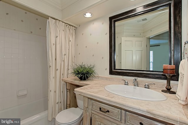 full bathroom with shower / tub combo with curtain, vanity, and toilet