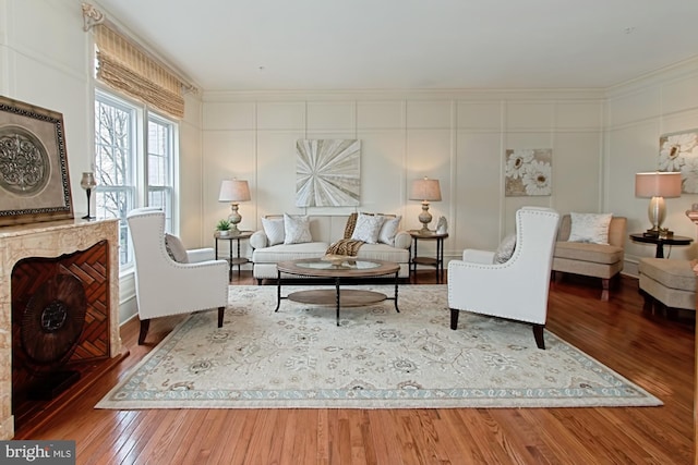 living room featuring crown molding and dark hardwood / wood-style floors