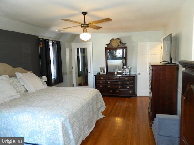 bedroom featuring ceiling fan and dark hardwood / wood-style flooring