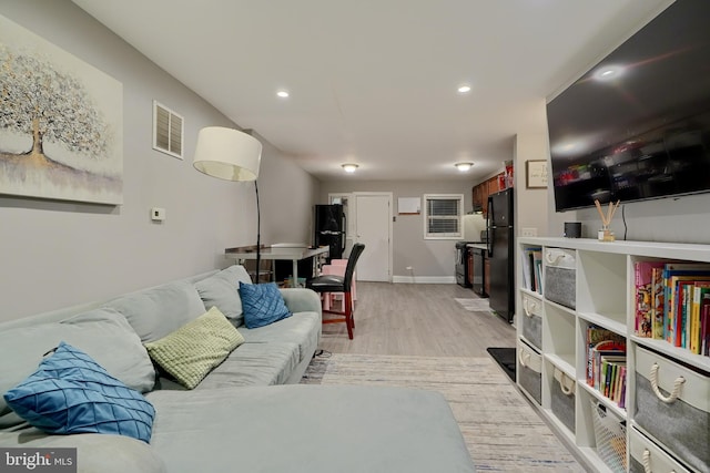 living room featuring light hardwood / wood-style floors