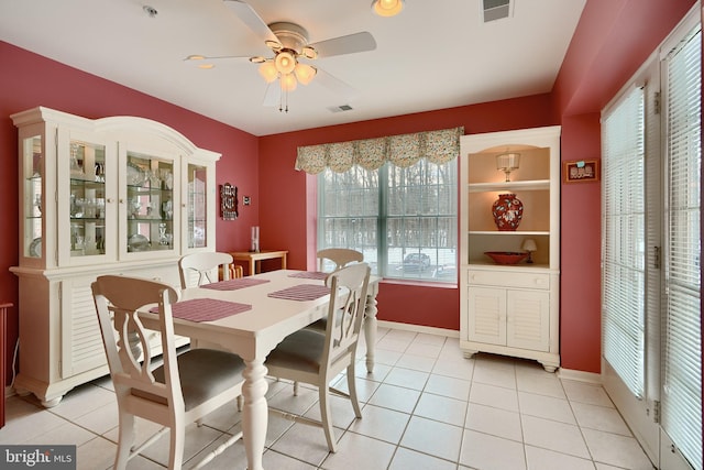 dining room with ceiling fan and light tile patterned floors