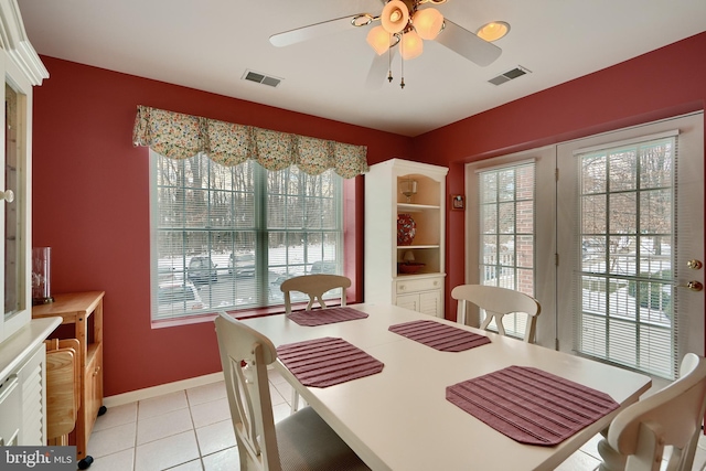 dining area featuring ceiling fan and light tile patterned flooring