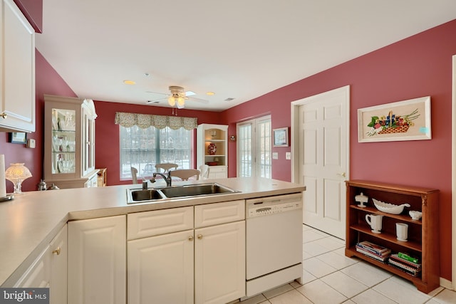 kitchen featuring dishwasher, ceiling fan, sink, white cabinetry, and light tile patterned flooring