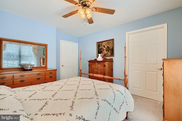 bedroom featuring ceiling fan and light colored carpet