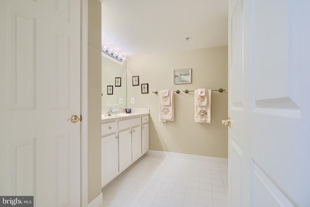 bathroom featuring tile patterned flooring and vanity