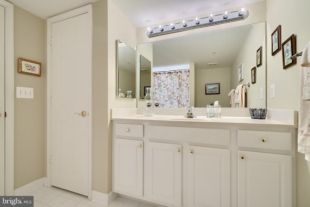 bathroom with vanity and tile patterned floors