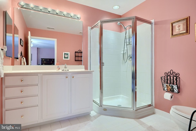 bathroom featuring walk in shower, lofted ceiling, vanity, and toilet