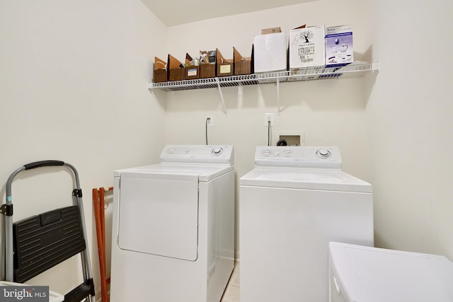 washroom featuring washing machine and dryer