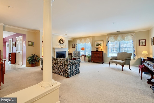 living room featuring light colored carpet, crown molding, and ornate columns