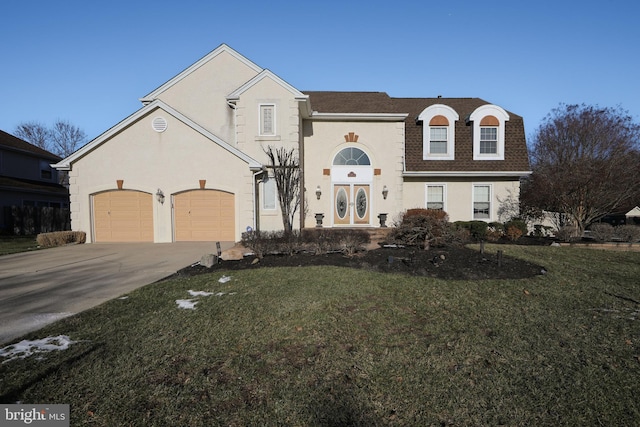 view of property with a front yard and a garage