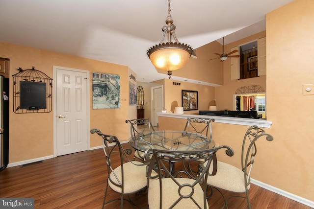 dining space featuring ceiling fan and dark hardwood / wood-style flooring