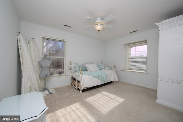 bedroom featuring ceiling fan and light colored carpet