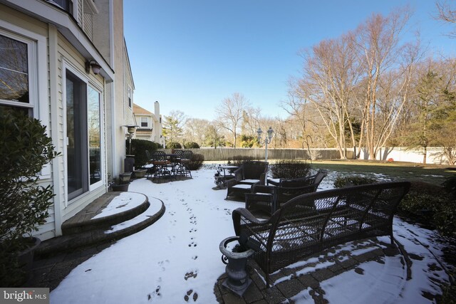 view of snow covered patio