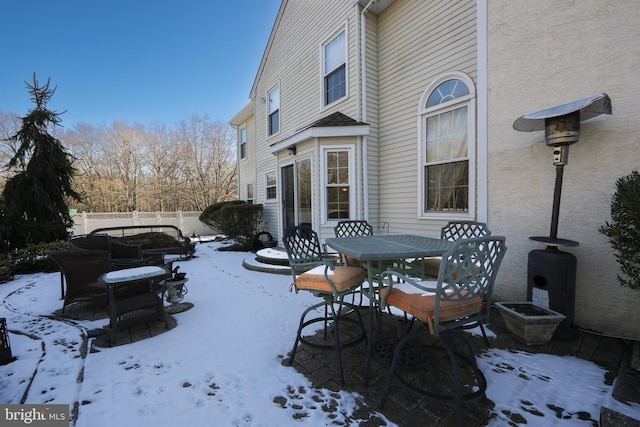 view of snow covered patio