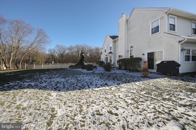 view of snow covered property