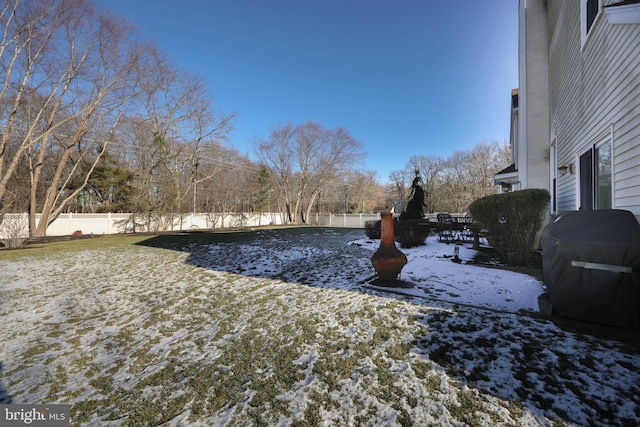 view of yard layered in snow