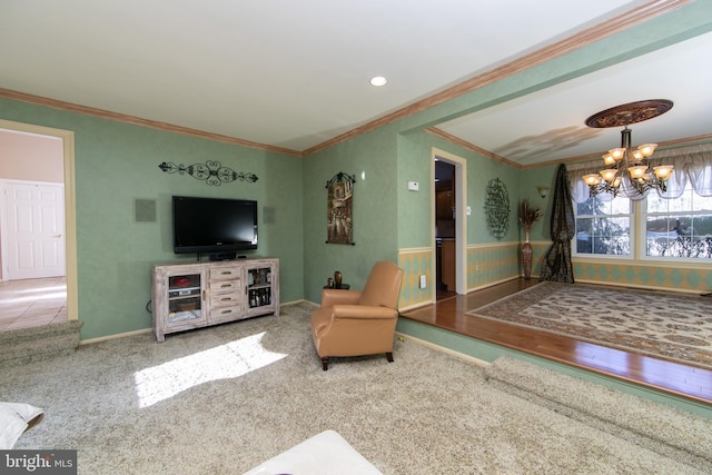 living room with carpet flooring, crown molding, and an inviting chandelier