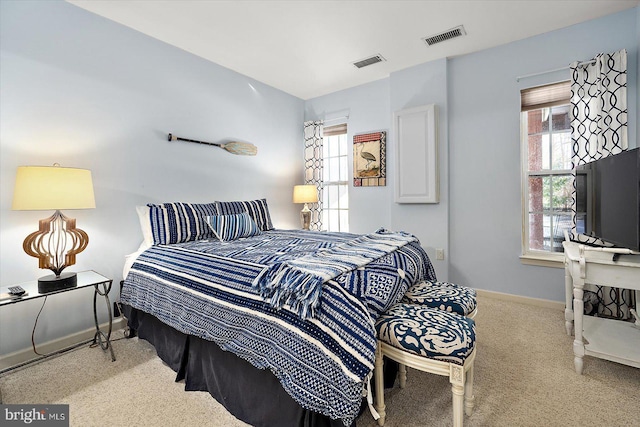 bedroom featuring light colored carpet