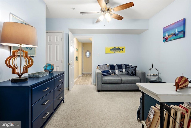 living room featuring ceiling fan and light carpet