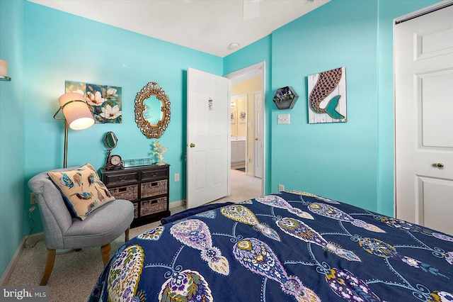 carpeted bedroom featuring a closet