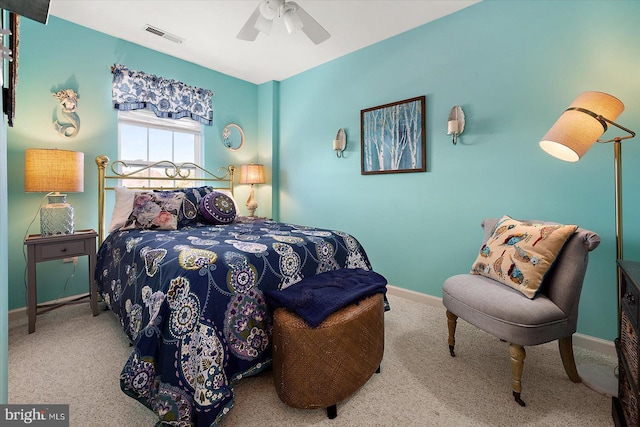 bedroom featuring ceiling fan and carpet