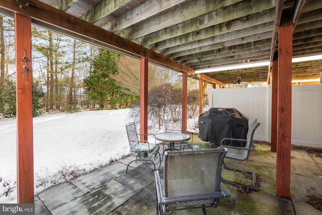 snow covered patio with grilling area