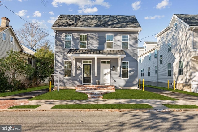 view of front facade featuring a front yard