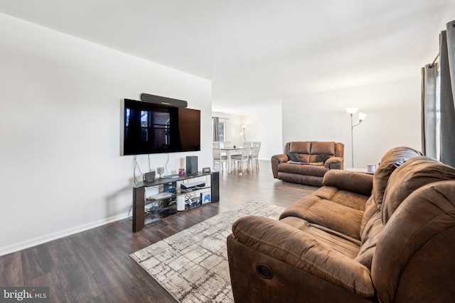 living room with dark hardwood / wood-style floors