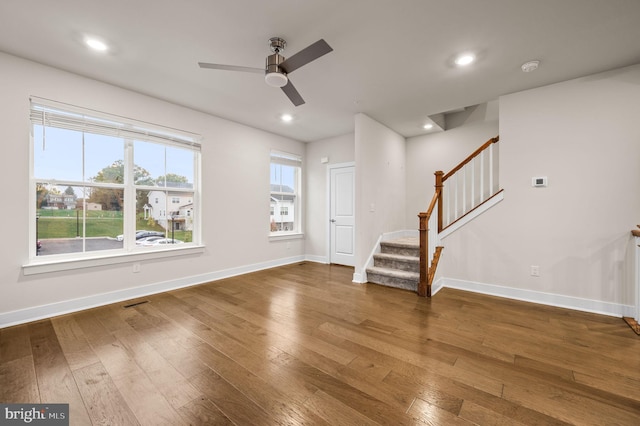 interior space with dark hardwood / wood-style flooring and ceiling fan