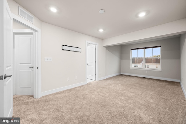 spare room with light carpet