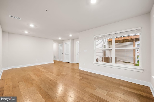 unfurnished living room featuring light hardwood / wood-style flooring