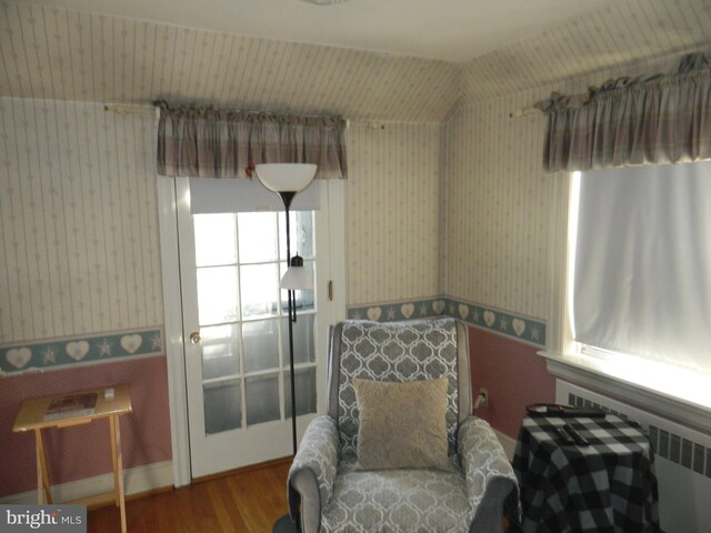 living area with hardwood / wood-style flooring