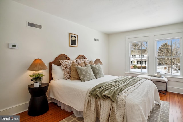 bedroom with wood-type flooring