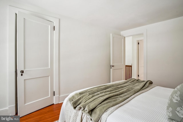 bedroom with hardwood / wood-style floors