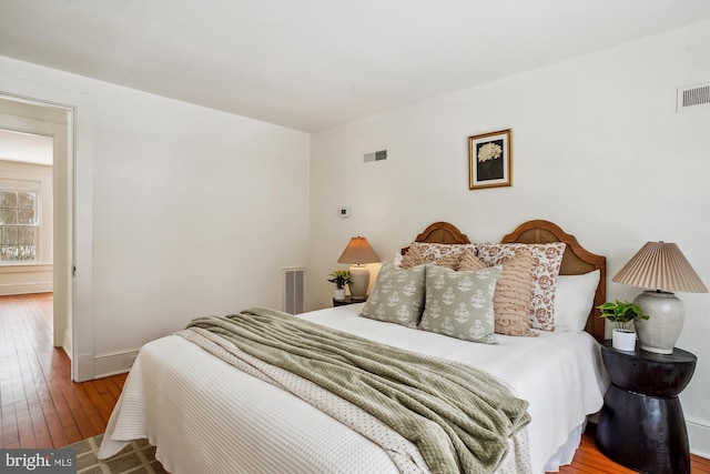 bedroom featuring wood-type flooring