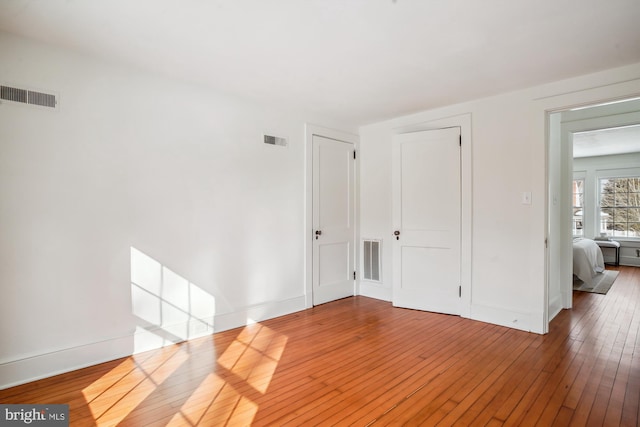 empty room featuring hardwood / wood-style floors