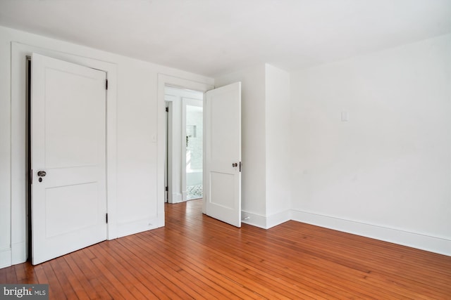 unfurnished bedroom with wood-type flooring