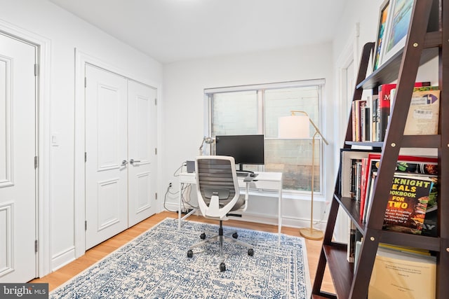 office space with hardwood / wood-style floors