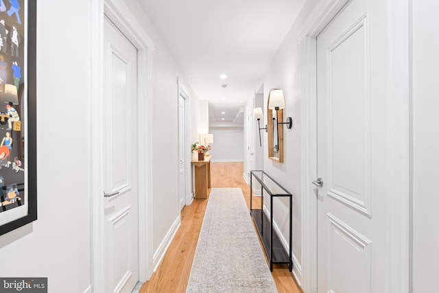 corridor featuring light hardwood / wood-style floors