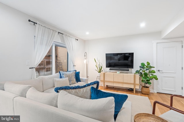 living room with light hardwood / wood-style floors