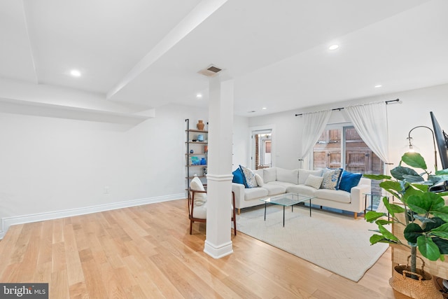 living room with light hardwood / wood-style flooring