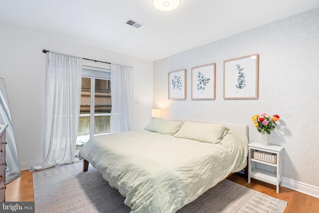 bedroom featuring hardwood / wood-style floors