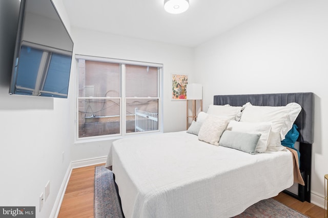 bedroom with wood-type flooring