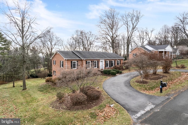 view of front of home with a front lawn