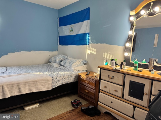 bedroom featuring wood-type flooring