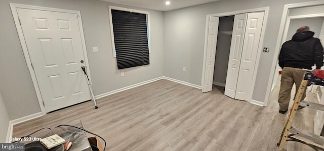 foyer entrance with light wood-type flooring