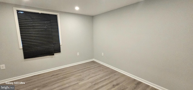 spare room featuring hardwood / wood-style floors