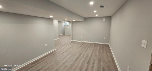 basement with light wood-type flooring