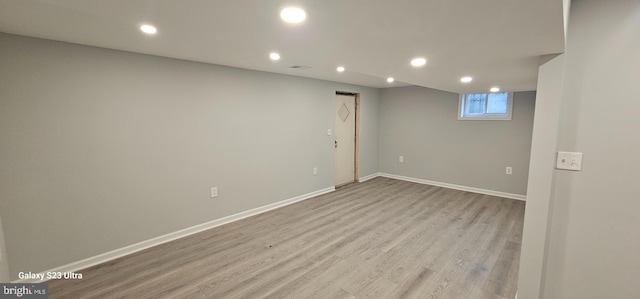 unfurnished room with light hardwood / wood-style flooring