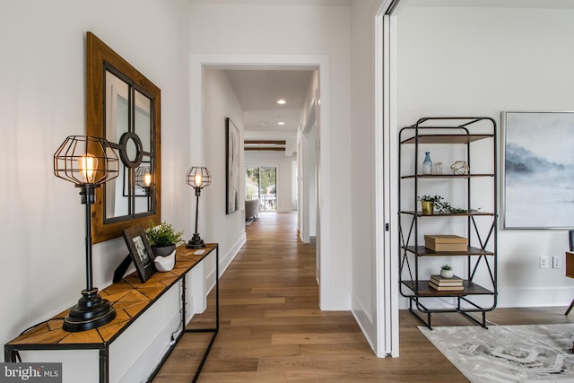 corridor with wood-type flooring